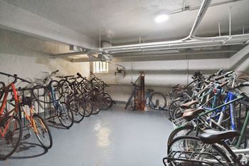 A bike parking area with many bikes.
